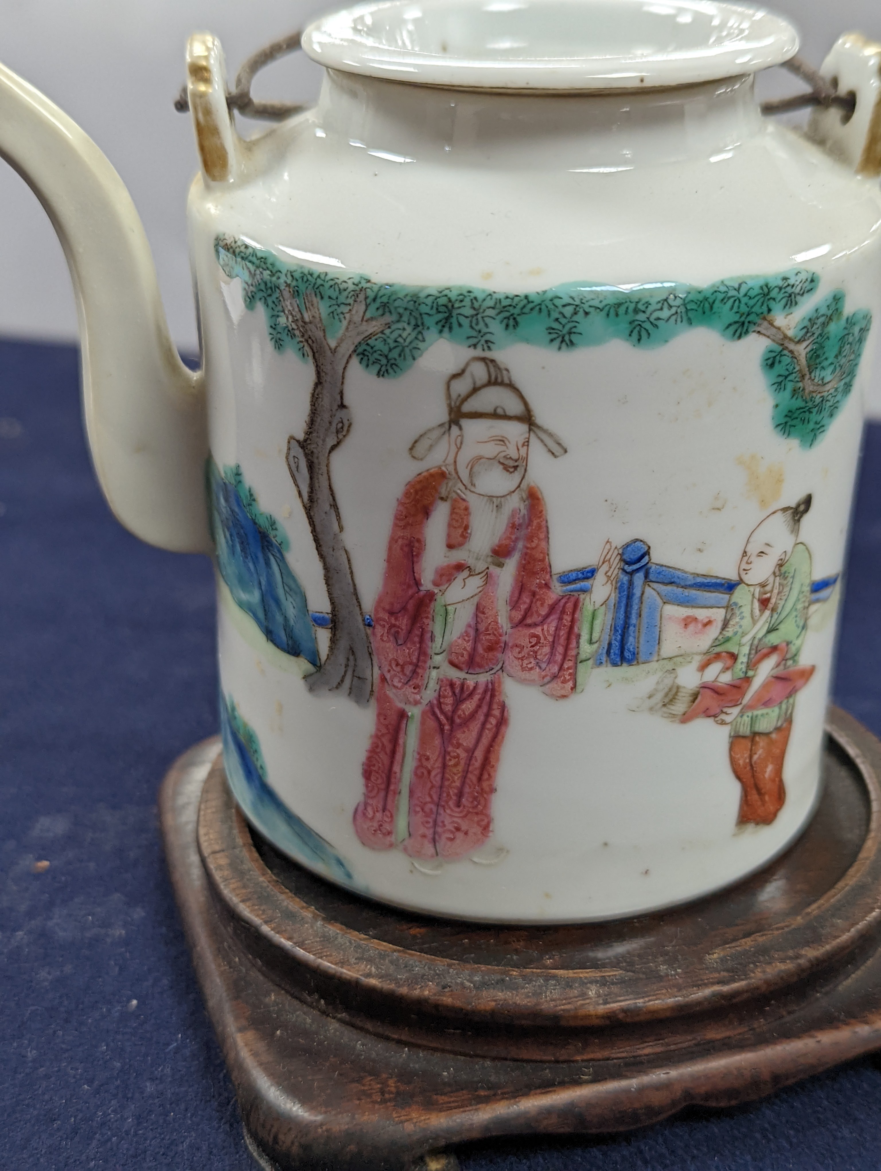 A Chinese famille rose cylindrical teapot and cover, 19th century 11cm, wood stand